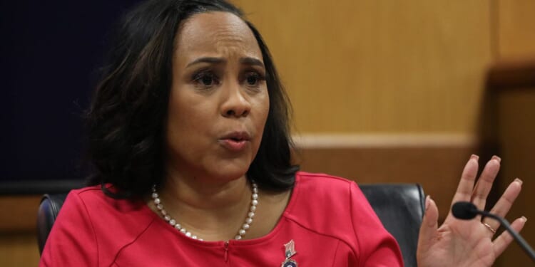 Fulton County District Attorney Fani Willis testifies during a hearing in the case of the State of Georgia v. Donald John Trump at the Fulton County Courthouse in Atlanta, Georgia, on Thursday.