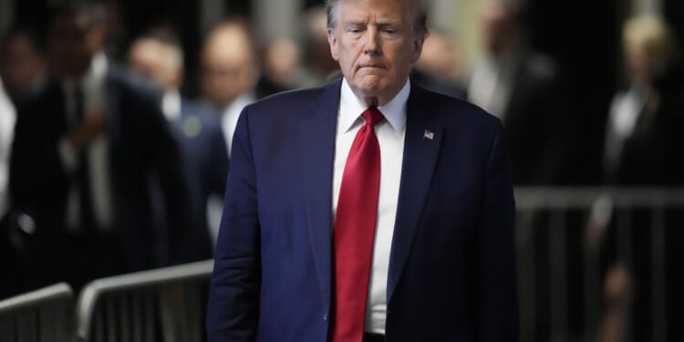 Former President Donald Trump leaves Manhattan criminal court in New York City on Feb. 15.