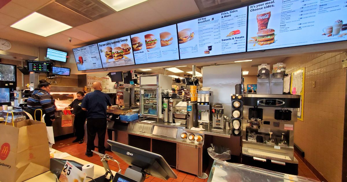 The counter area, kitchen and menus are visible in a wide-angle view of the interior of a McDonald's restaurant in San Ramon, California, on Jan. 21, 2020.