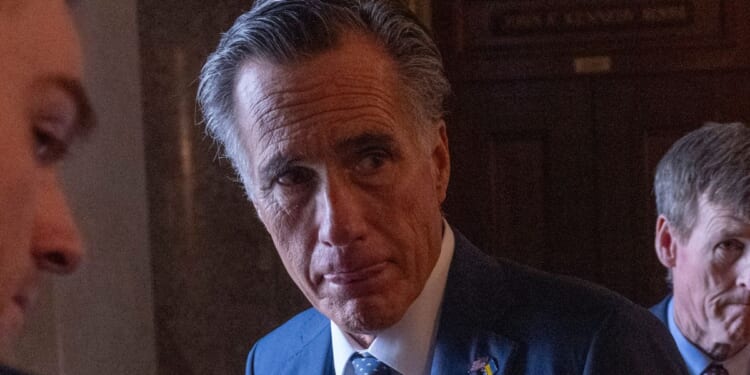 Sen. Mitt Romney speaks to reporters at the U.S. Capitol in Washington, D.C., on Sunday.