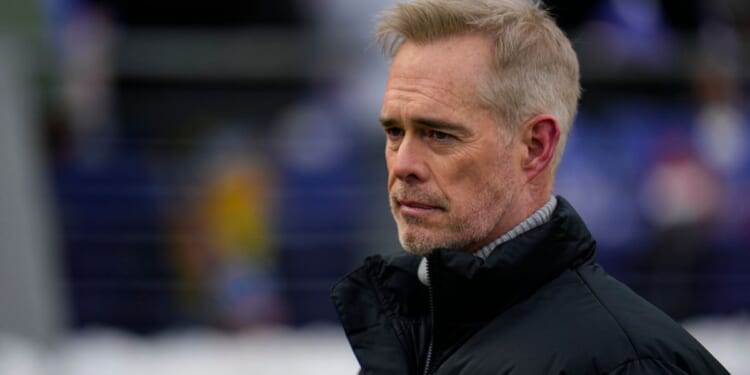 ESPN broadcaster Joe Buck walks the field before an NFL football AFC divisional playoff game between the Baltimore Ravens and the Houston Texans, Jan. 20, in Baltimore.