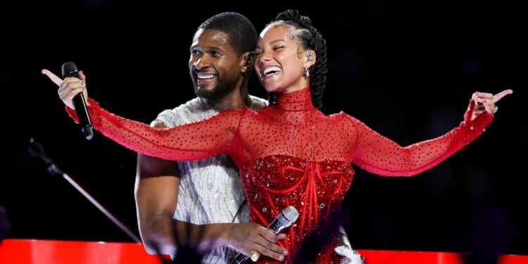 Usher, left, and Alicia Keys, right, perform during Super Bowl LVIII halftime show in Las Vegas, Nevada, on Sunday.