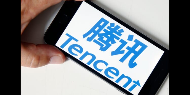 In this photo illustration, the logo of Chinese tech company Tencent is displayed on the screen of an iPhone on June 6, 2018 in Paris, France.