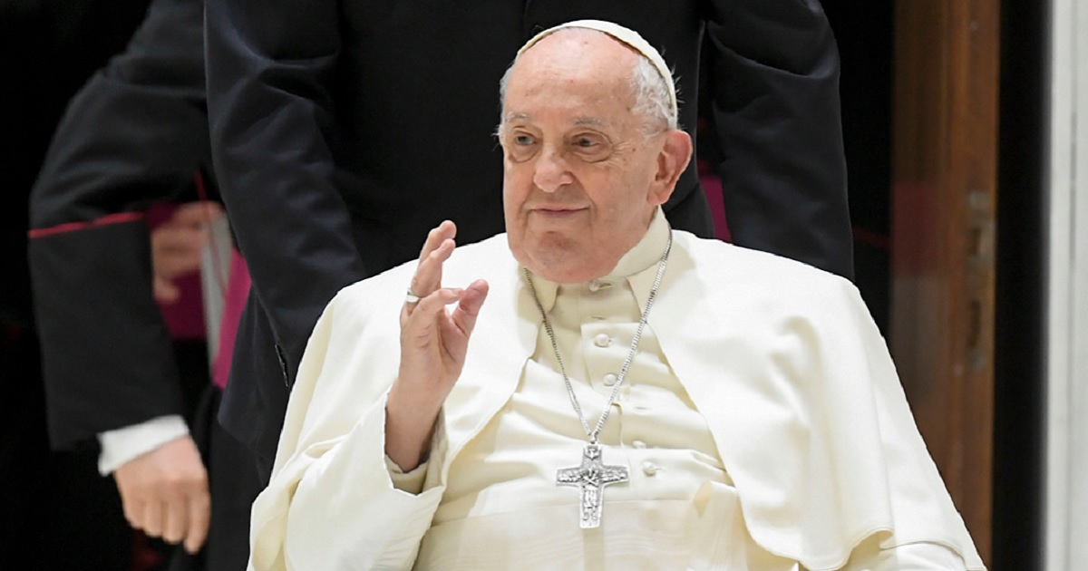 Pope Francis greets the faithful Wednesday during his weekly audience at the Paul VI Hall in Vatican City. The pope was taken to a Rome hospital after the audience but later returned to the Vatican.