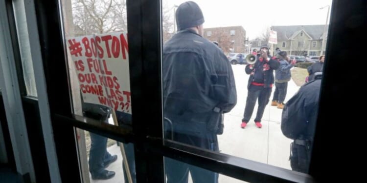 Residents of Roxbury, Massachusetts, protest outside a rec center that's been converted to illegal immigrant housing.