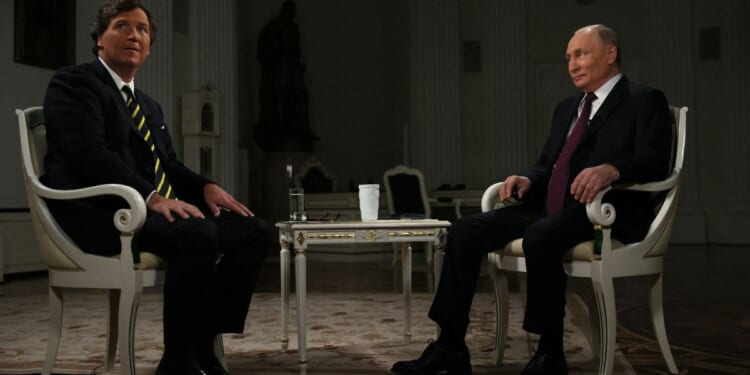 Tucker Carlson, left, interviews Russian President Vladimir Putin in Moscow, Russia, on Feb. 6.