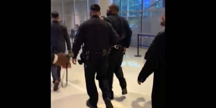 Killer Mike is escorted from the Grammy Awards in handcuffs.