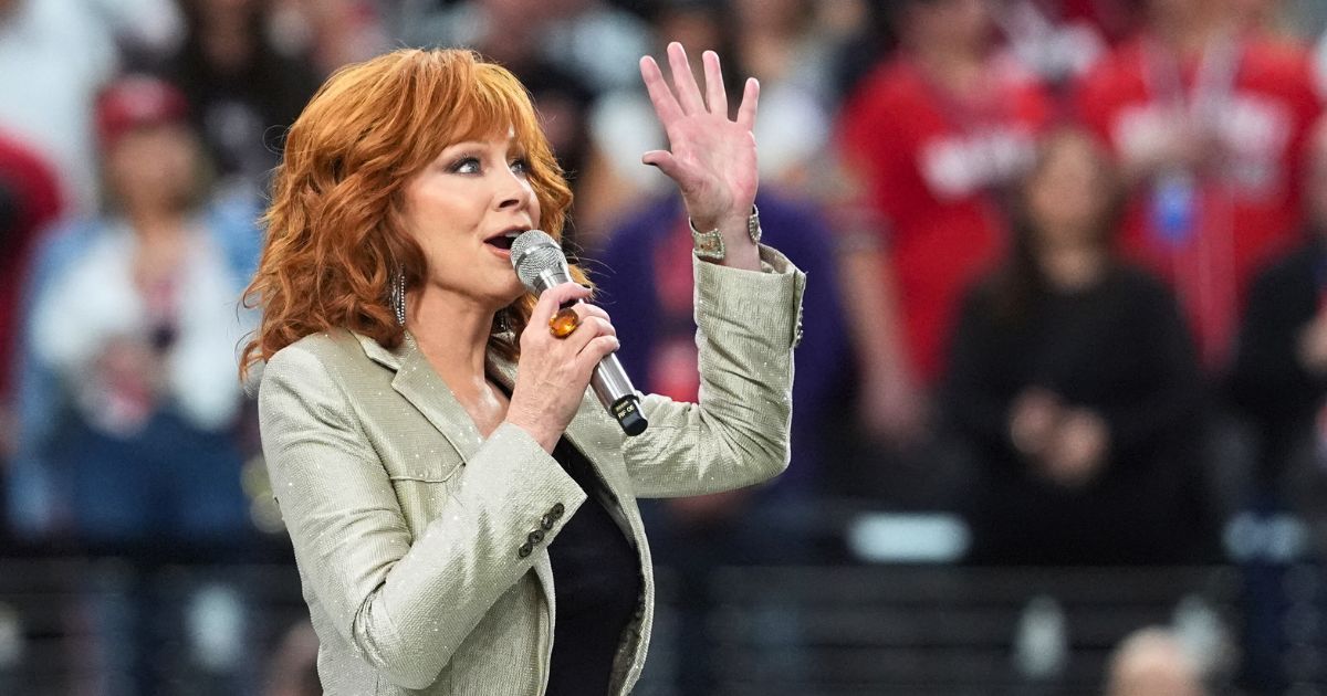 Reba McEntire sings the national anthem ahead of Super Bowl LVIII between the Kansas City Chiefs and the San Francisco 49ers at Allegiant Stadium in Las Vegas on Sunday.