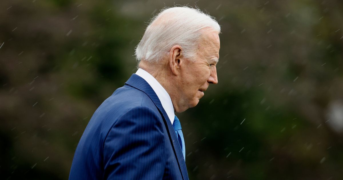 President Joe Biden walks across the South Lawn before boarding Marine One to depart the White House in Washington on Wednesday. "I'm going to Walter Reed to get my physical," Biden told reporters.