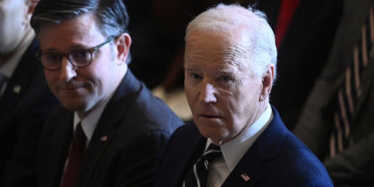 President Joe Biden, right, and Speaker of the House Mike Johnson attend an event at the U.S. Capitol in Washington, D.C., on Thursday.