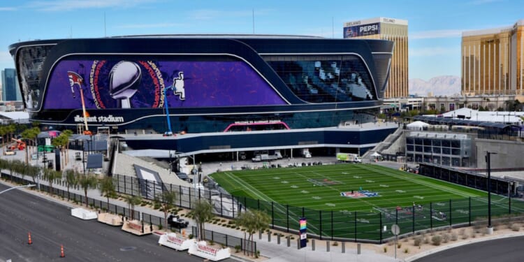 Workers prepare the field Wednesday at Allegiant Stadium in Las Vegas, ahead of Super Bowl 58.