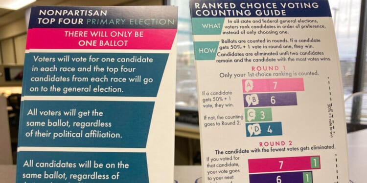 Brochures are displayed at the Alaska Division of Elections office in Anchorage, Alaska, on Jan. 21, 2022, detailing changes to elections.