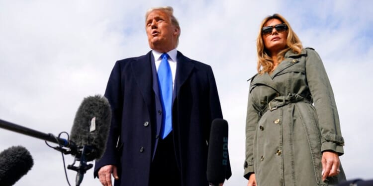 Former President Donald Trump and former first lady Melania Trump board Air Force One in October 2020. Donald Trump said Tuesday expect to see more of Melania on the campaign trail this year.