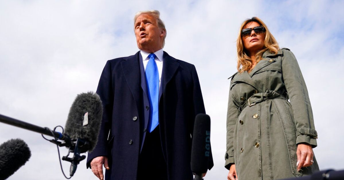 Former President Donald Trump and former first lady Melania Trump board Air Force One in October 2020. Donald Trump said Tuesday expect to see more of Melania on the campaign trail this year.