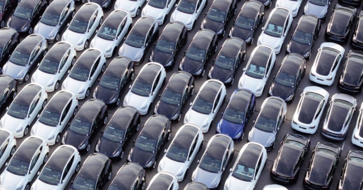 An aerial photo shows Teslas, Volkswagen, Audi and Skoda new cars in the car depot for Germany's port of Rostock Jan. 29.