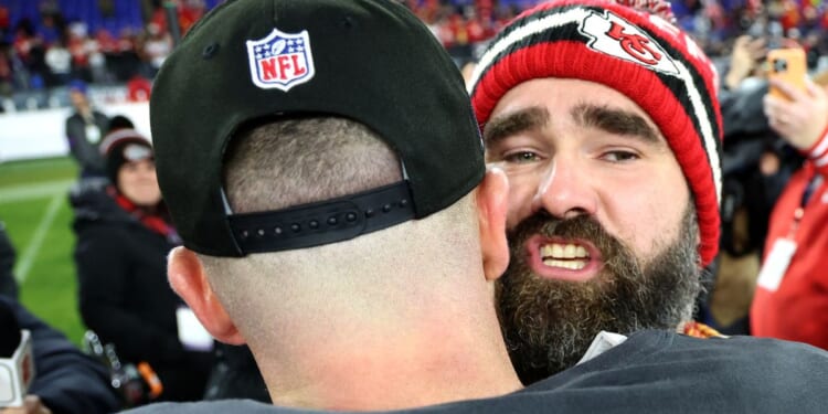 Jason Kelce, right, hugs brother Travis Kelce after the Kansas City Chiefs defeated the Baltimore Ravens in the AFC Championship Game in Baltimore, Maryland, on Jan. 28.