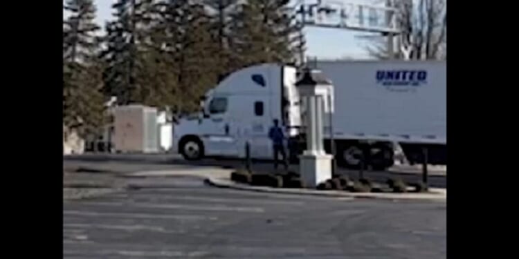 A semi caught at a railroad crossing in Versailles, Ohio, on Feb. 7.