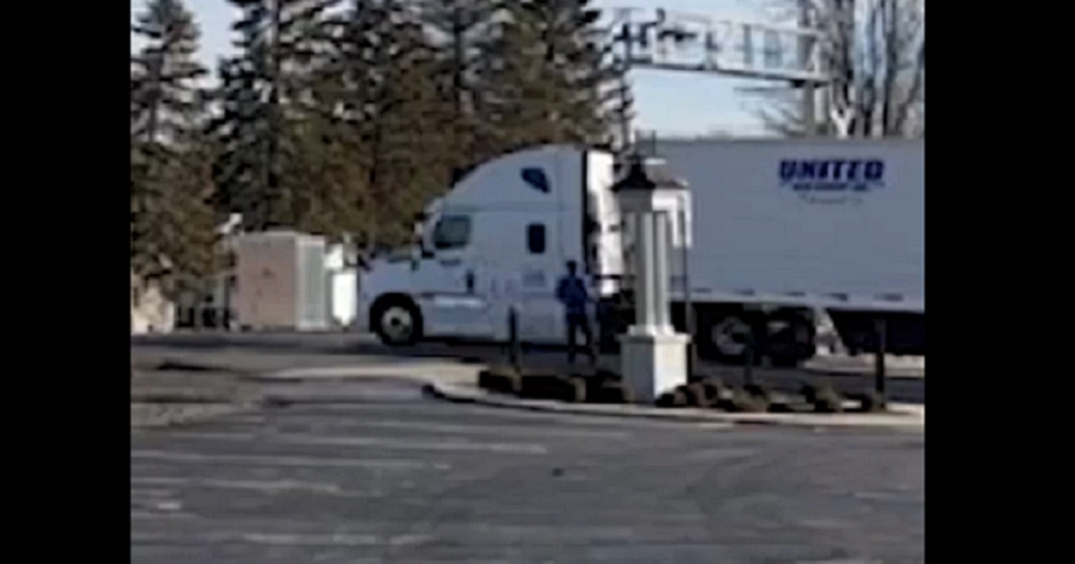 A semi caught at a railroad crossing in Versailles, Ohio, on Feb. 7.