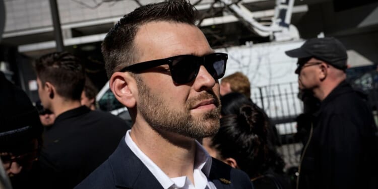 Jack Posobiec arrives to gather with supporters of former President Donald Trump outside the New York courthouse where Trump was arraigned on April 4.