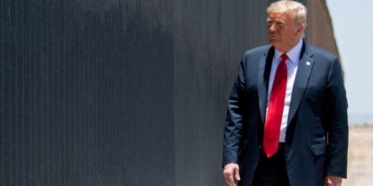 Then-President Donald Trump participates in a ceremony commemorating the 200th mile of border wall at the international border with Mexico in San Luis, Arizona, on June 23, 2020.