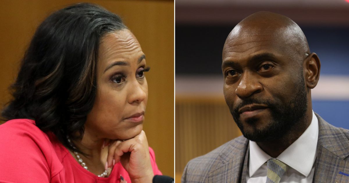 Fani Willis, left, district attorney in Georgia's Fulton County, and special prosecutor Nathan Wade, right, look on during a hearing to determine whether the two should be disqualified from the case for allegedly lying about a personal relationship.