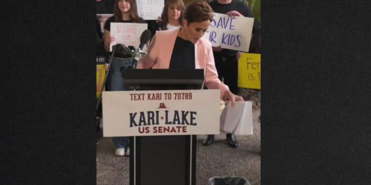 Senate candidate Kari Lake threw a copy of Congress' border bill in a wastebasket Wednesday, saying that's where the flawed plan belongs.