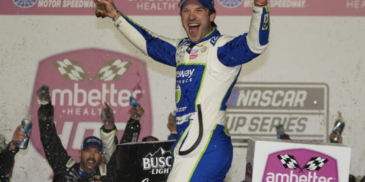 Daniel Suarez celebrates after winning the NASCAR auto race at Atlanta Motor Speedway in Hampton, Georgia, on Sunday.