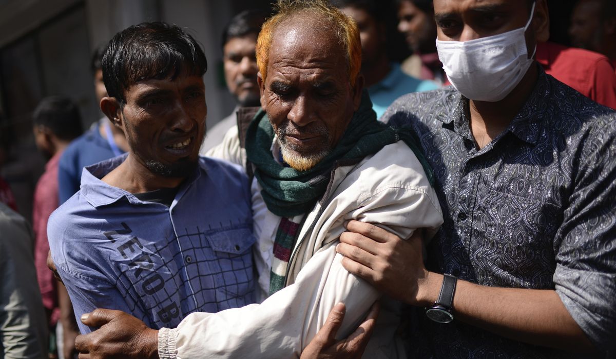 Bangladeshi leader says a shopping mall that caught fire had no emergency exits. Death toll climbs