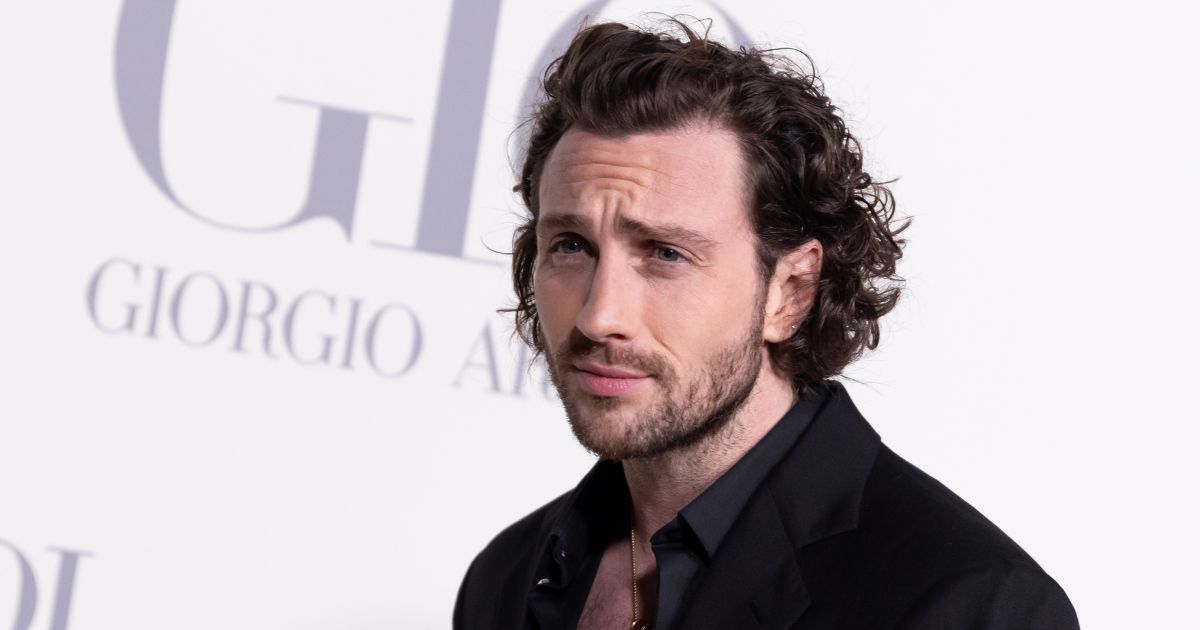 Aaron Taylor-Johnson at the Madrid photocall for "ACQUA DI GIO" at Matadero Madrid in 2024.