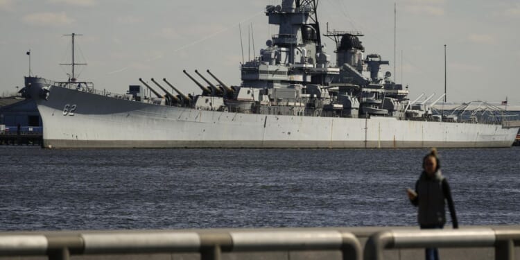 USS New Jersey, battleship on the Delaware River, traveling to Philadelphia for repairs