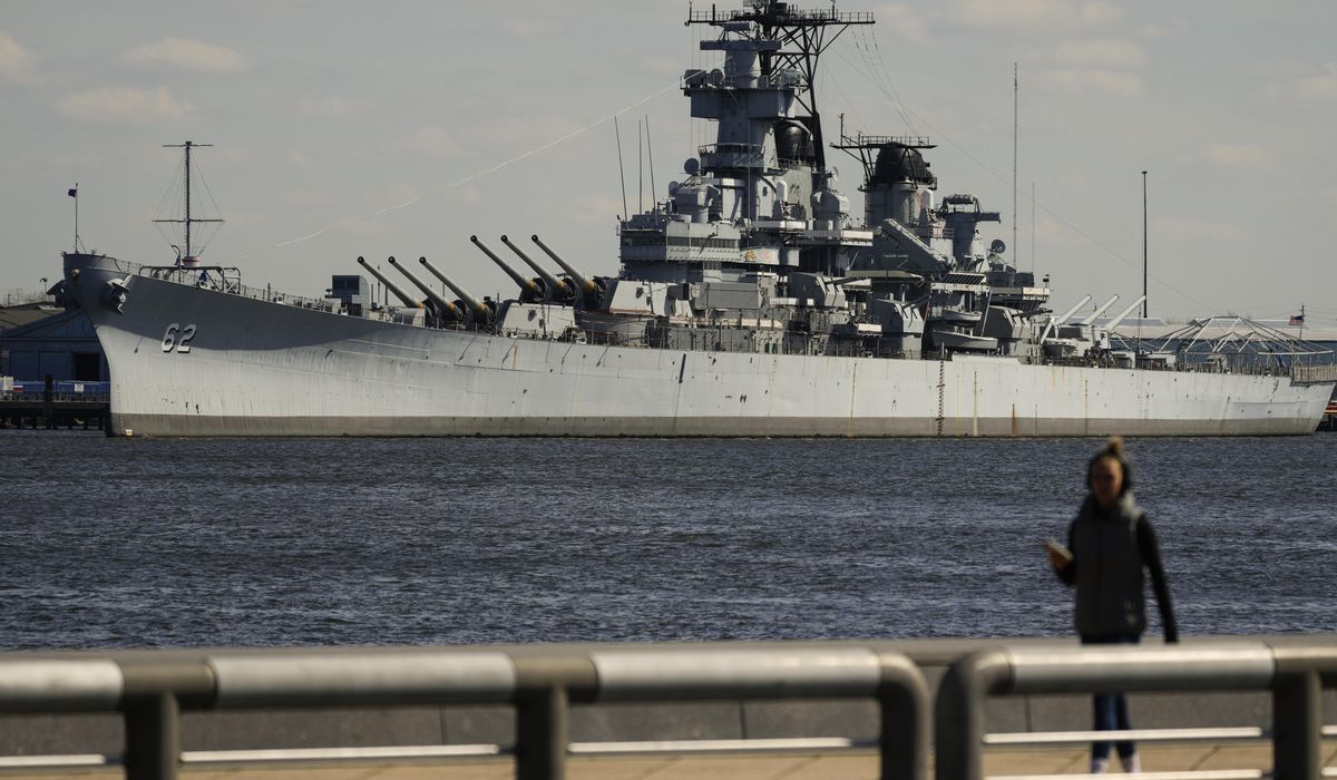 USS New Jersey, battleship on the Delaware River, traveling to Philadelphia for repairs