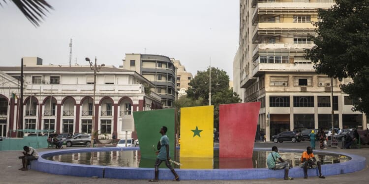 Senegal votes in a tightly contested presidential race after months of unrest