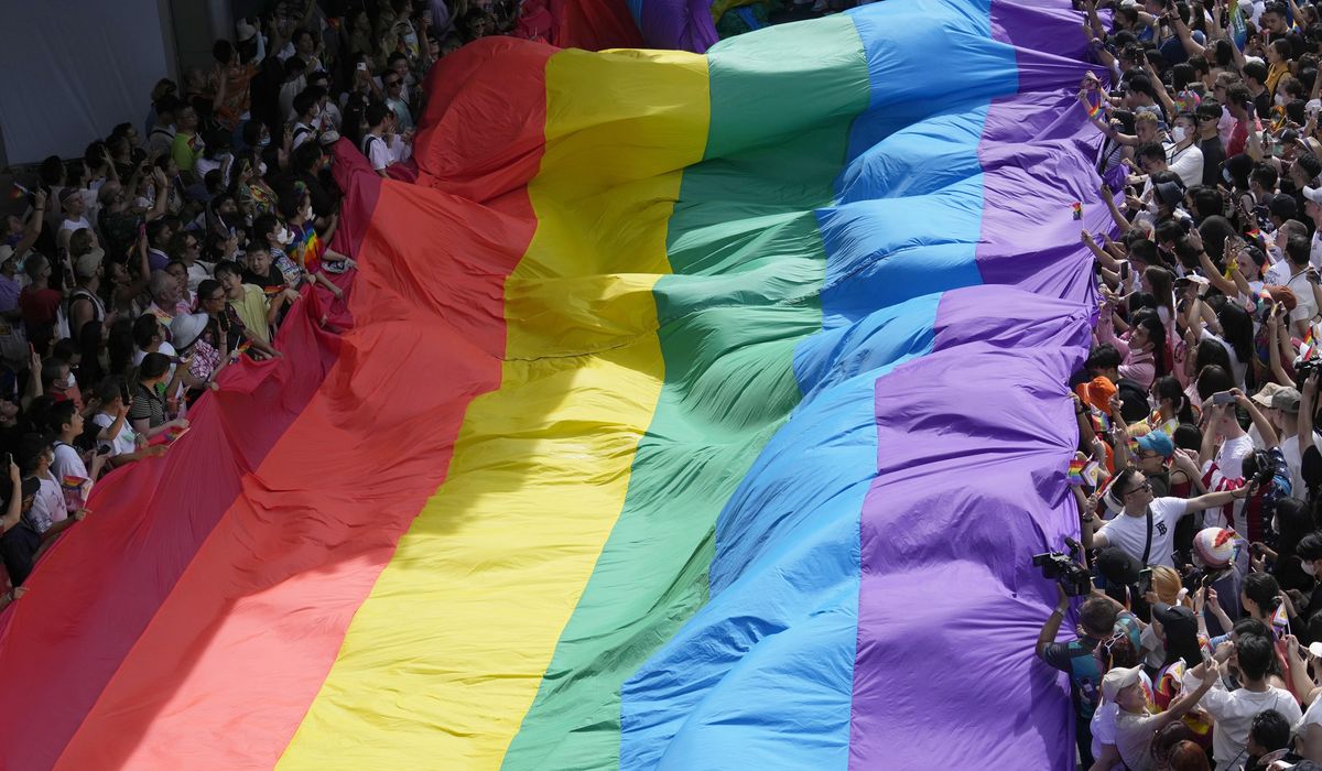 Lawmakers in Thailand overwhelmingly approve a bill to legalize same-sex marriage