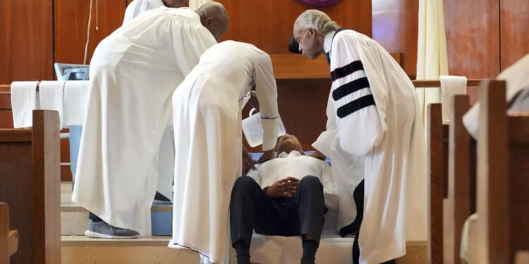 Eric Adams, NYC mayor, gets baptized in jail by Rev. Al Sharpton on Good Friday