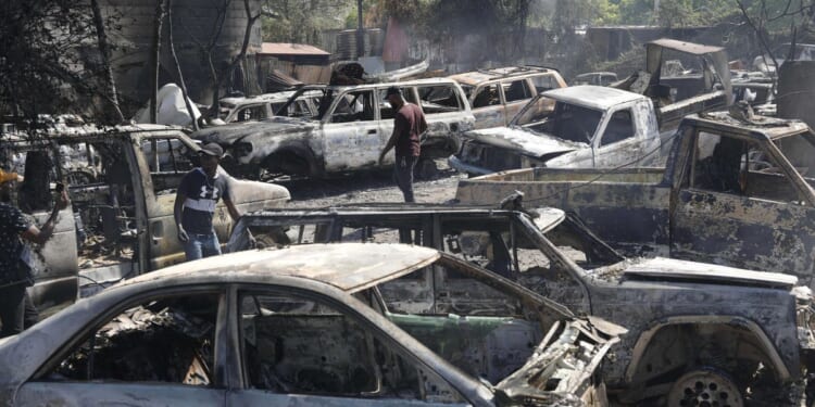 Police in Haiti say 2 men were hacked to death by mob who thought they were buying ammo for gangs