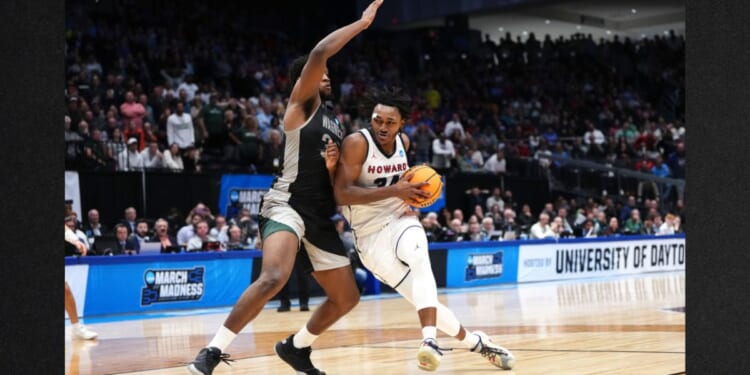 Bryce Harris #34 of the Howard Bison drives against Keyontae Lewis #32 of the Wagner Seahawks during the second half in the First Four game during the NCAA Men's Basketball Tournament at University of Dayton Arena on Tuesday in Dayton, Ohio.