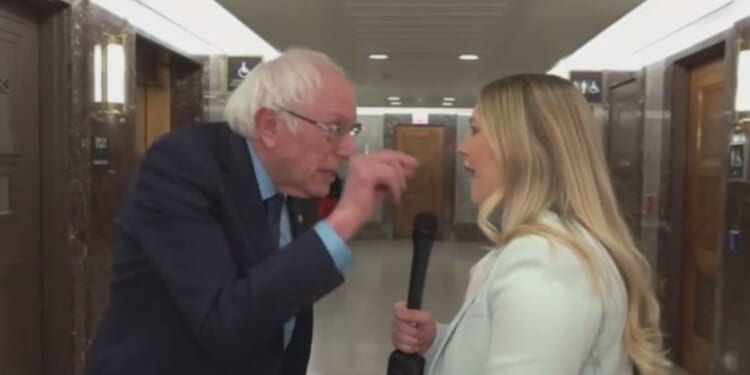 Sen. Bernie Sanders, of Vermont, left, erupted at Fox Business correspondent Hillary Vaughn on Thursday, telling her during an exchange inside the Capitol, “I can yell as loud as you.”