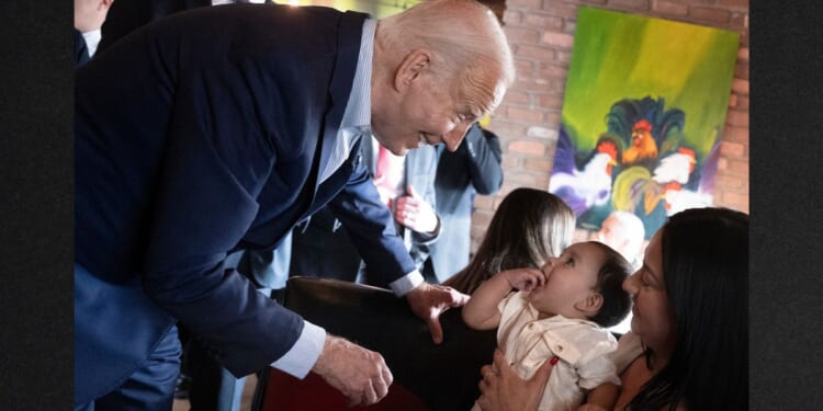 President Joe Biden wandered off the stage area to visit with a mother and baby while his campaign manager was introducing him during a campaign event at a Mexican restaurant in Phoenix, Arizona, on Tuesday.