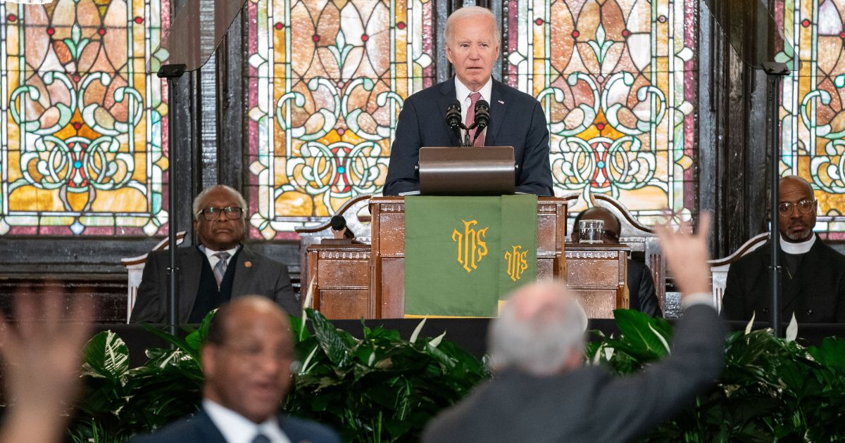 President Joe Biden watches as protesters are escorted out of the Emanuel AME Church on Jan. 8 in Charleston, South Carolina.