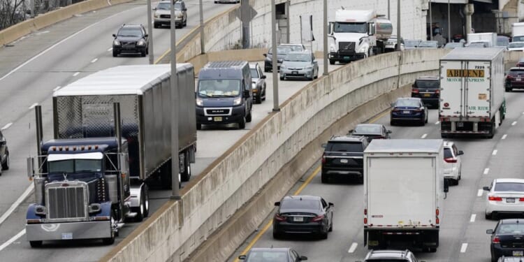 Motor vehicle traffic moves along Interstate 76 in Philadelphia in 2021. The EPA on Friday set new gas emissions standards for heavy-duty trucks, buses and other large vehicles.