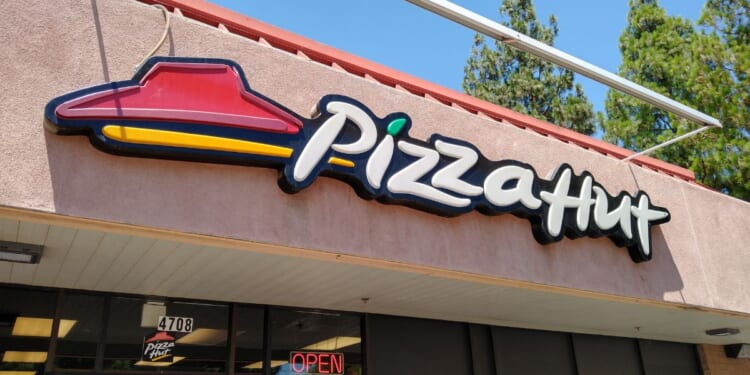 A stock photo shows the sign of a Pizza Hut restaurant in Bakersfield, California, on July 9, 2022.