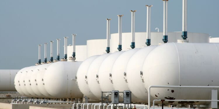 Gasoline storage tanks are seen in the above stock image.