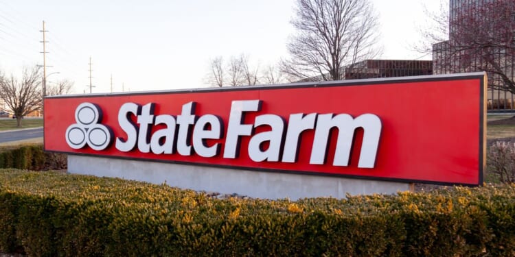 A State Farm sign is seen at the insurance giant's headquarters in Bloomington, Illinois, on March 26, 2022.