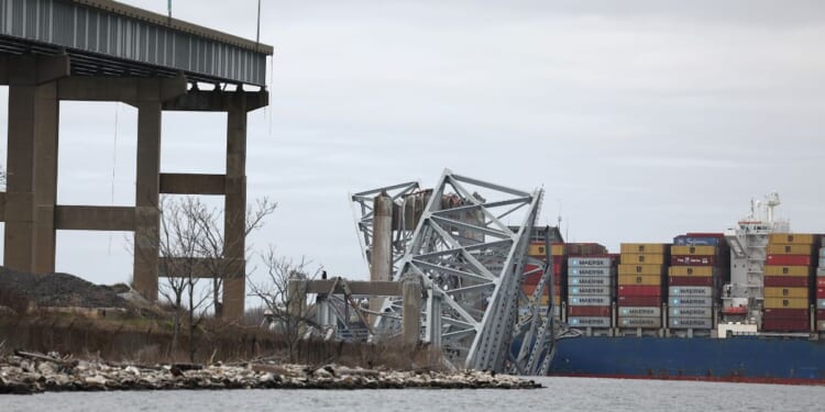 The cargo ship Dali sits in the water after running into and collapsing the Francis Scott Key Bridge in Baltimore, Maryland, on Tuesday.