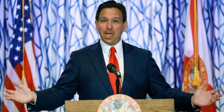 Florida Gov. Ron DeSantis speaks during a news conference at the Santorini by Georgios restaurant in Miami Beach on March 20.