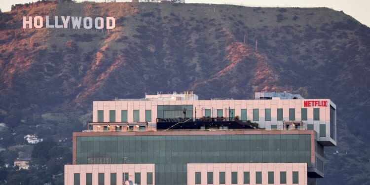 Netflix studios in Los Angeles, California, sitting in front of the Hollywood sign.