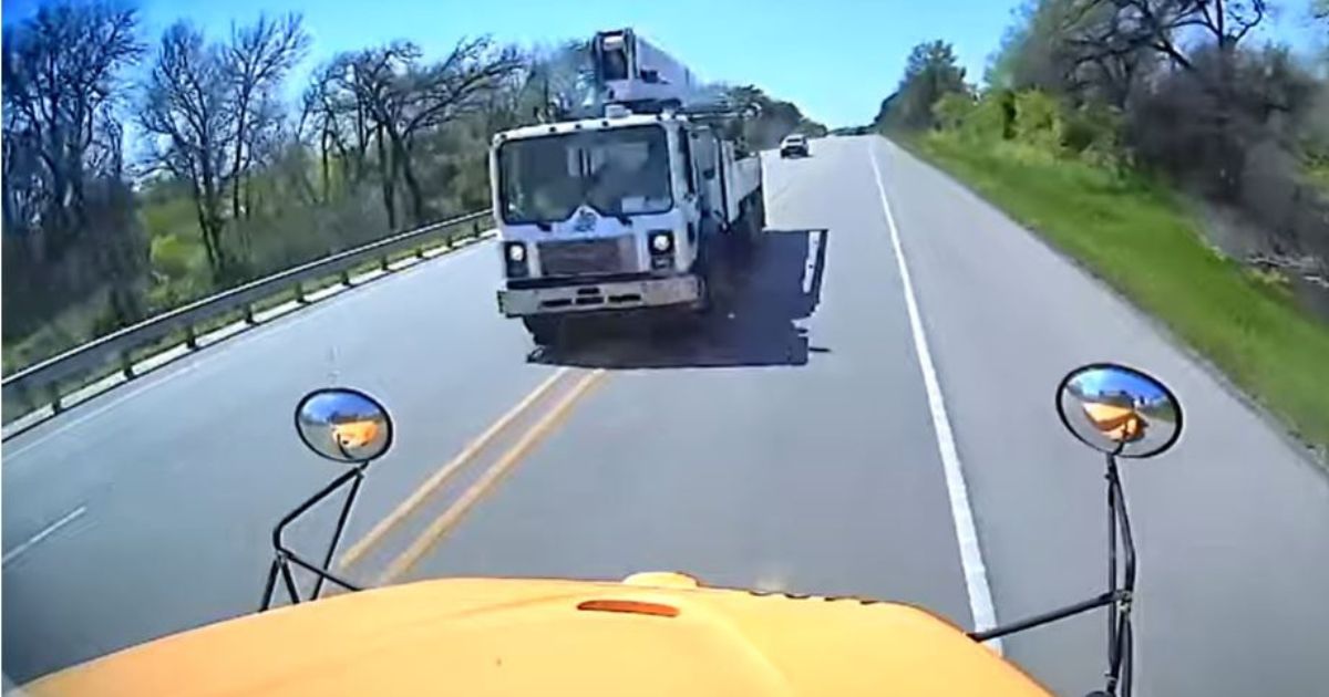 An image taken from a YouTube video shows the moment before a cement truck crashed into a school bus in Texas, killing one child on the bus and another driver on the road.