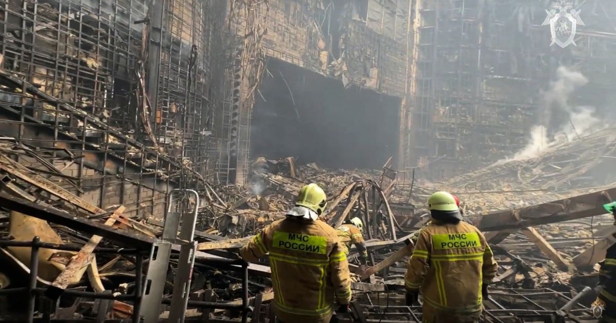 firefighters working in the burned concert hall after an attack on the building of the Crocus City Hall in Moscow