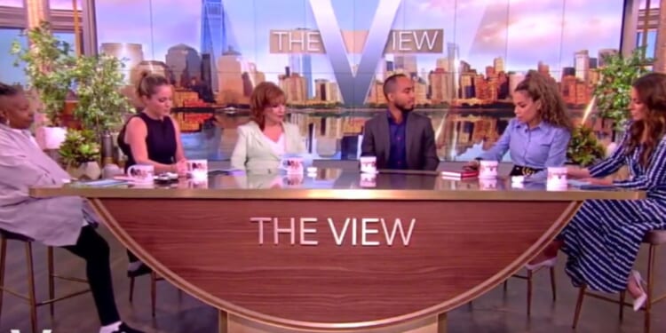 Sunny Hostin (second from right), co-host of "The View," looks down before telling guest Coleman Hughes that his position about race and socioeconomic status is "fundamentally flawed."