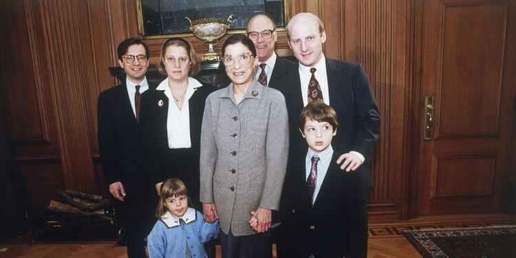 Supreme Court Justice Ruth Bader Ginsburg, center, poses with her family in Washington on Oct. 1, 1993. From left are: son-in-law George Spera daughter Jane Ginsburg, husband Martin, son James Ginsburg. The judge's grandchildren Clara and Paul Spera are in front.